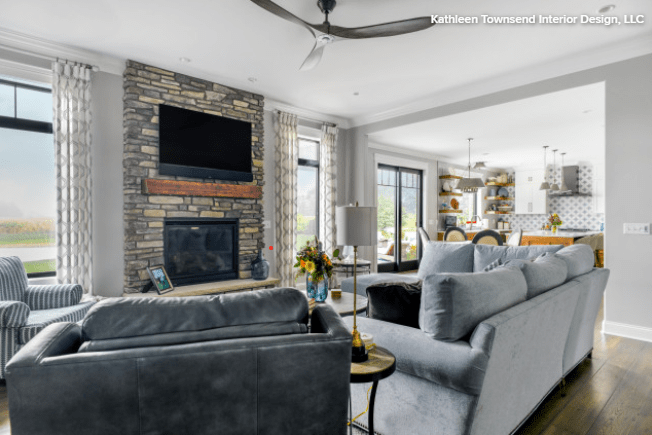 living room with gray couch in front of fireplace