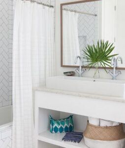 all white bathroom with splashes of color