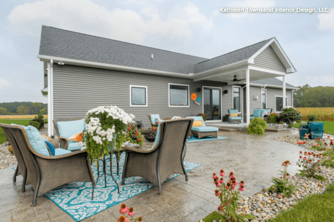 patio with wicker furniture with stamped concrete